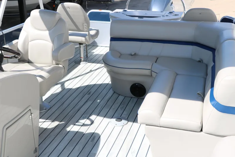 Slide: The Image of 2017 Berkshire 211RFC CTS pontoon boat interior with plush seating and spacious deck. - 16