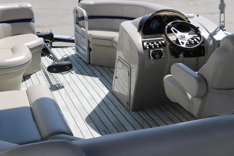 Slide: The Image of Interior of a 2017 Berkshire 211RFC CTS pontoon boat with seating and steering console. - 18