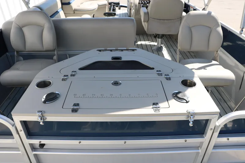 Slide: The Image of 2017 Berkshire 211RFC CTS pontoon boat interior with seating and table setup. - 20