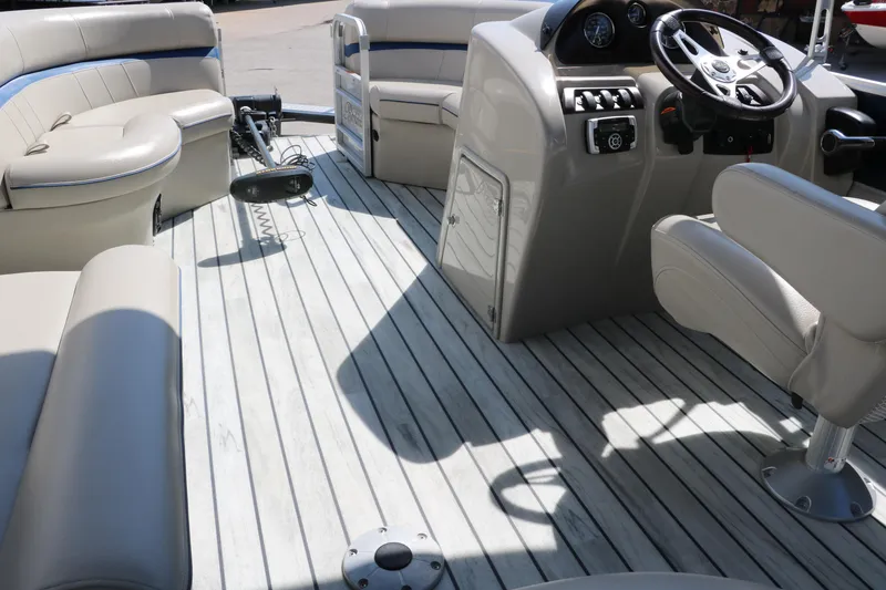Slide: The Image of 2017 Berkshire 211RFC CTS pontoon boat interior with seating and steering console. - 27