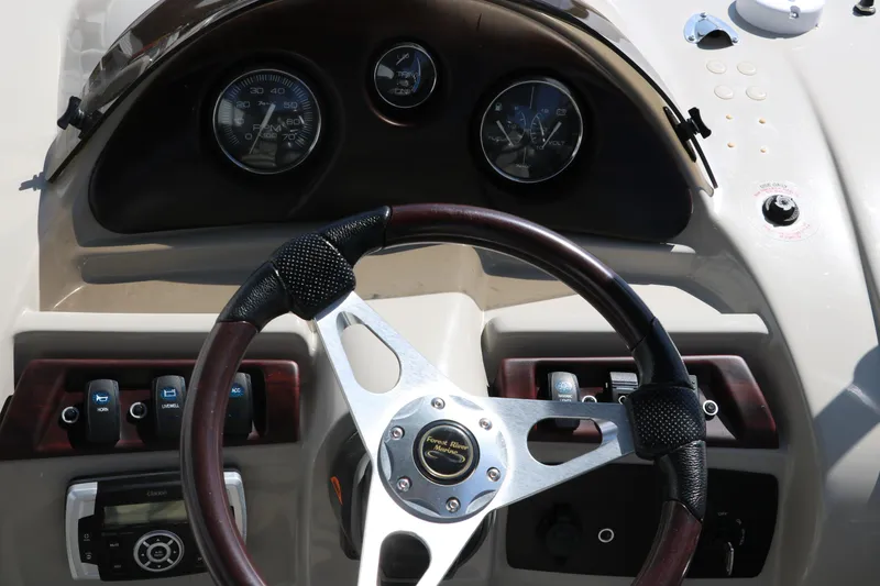 Slide: The Image of Steering wheel and dashboard of 2017 Berkshire 211RFC CTS boat. - 28