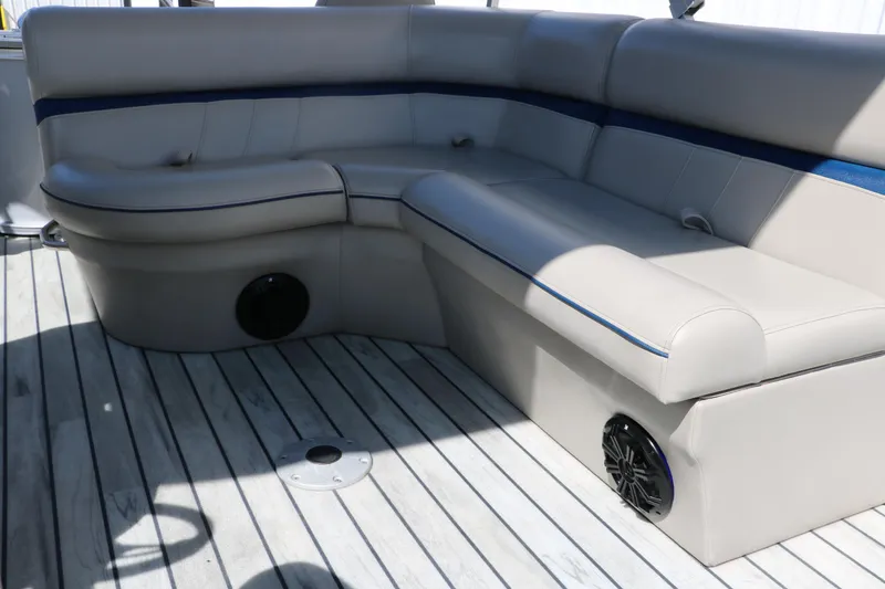 Slide: The Image of 2017 Berkshire 211RFC CTS boat interior with beige seating and wood flooring. - 30