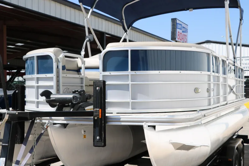 Slide: The Image of 2017 Berkshire 211RFC CTS pontoon boat with canopy, docked in a marina. - 7