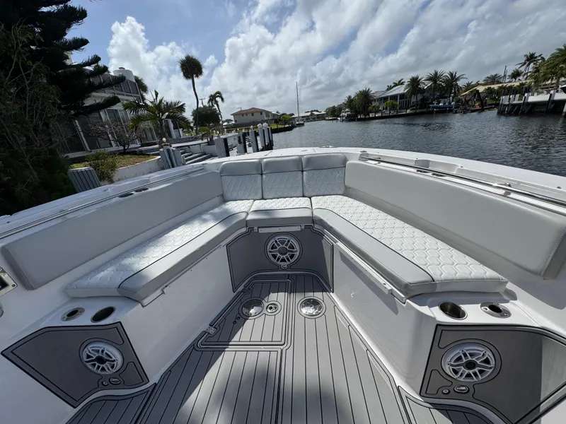 Slide: The Image of 2023 Sea Fox 328 Commander boat with spacious seating and scenic waterfront view. - 10