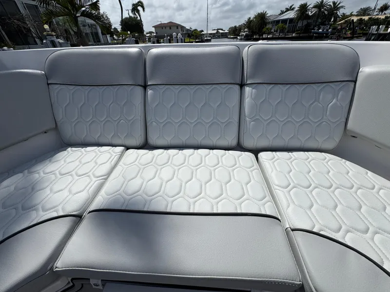 Slide: The Image of 2023 Sea Fox 328 Commander boat seating with hexagonal pattern upholstery. - 11