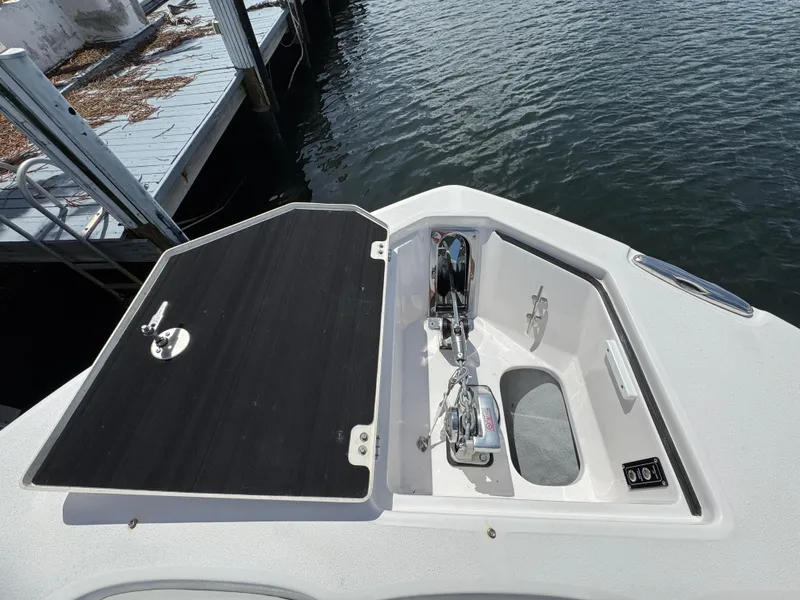 Slide: The Image of 2023 Sea Fox 328 Commander boat anchor compartment at dockside. - 12