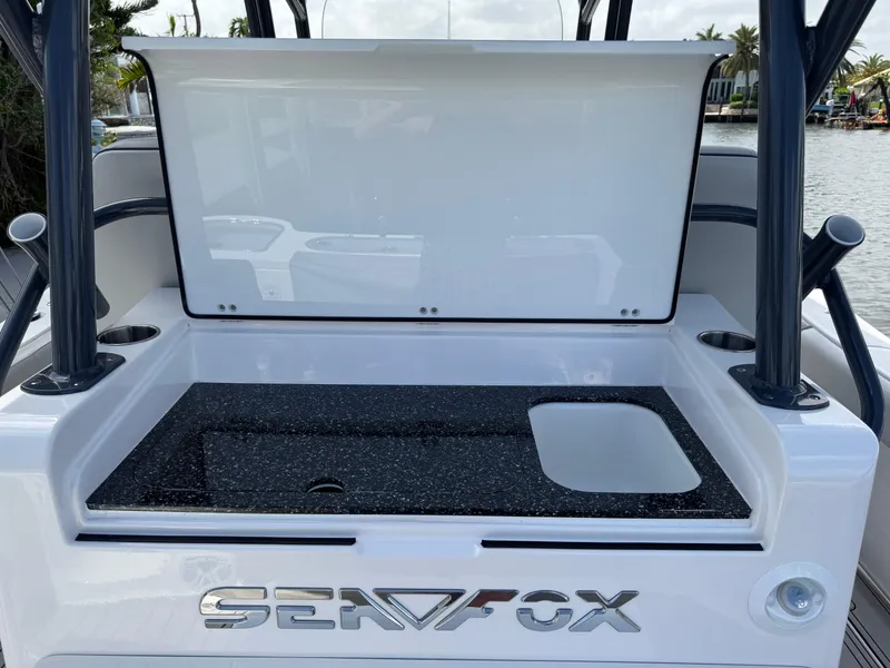Slide: The Image of 2023 Sea Fox 328 Commander boat with open storage compartment and sleek design. - 20
