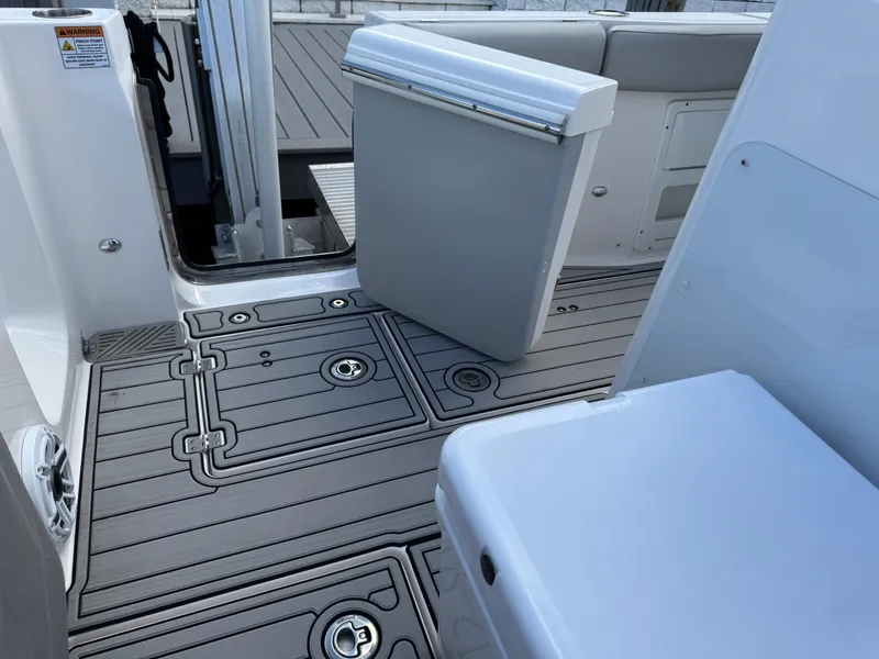 Slide: The Image of 2023 Sea Fox 328 Commander boat deck with sleek, modern design and storage compartments. - 25