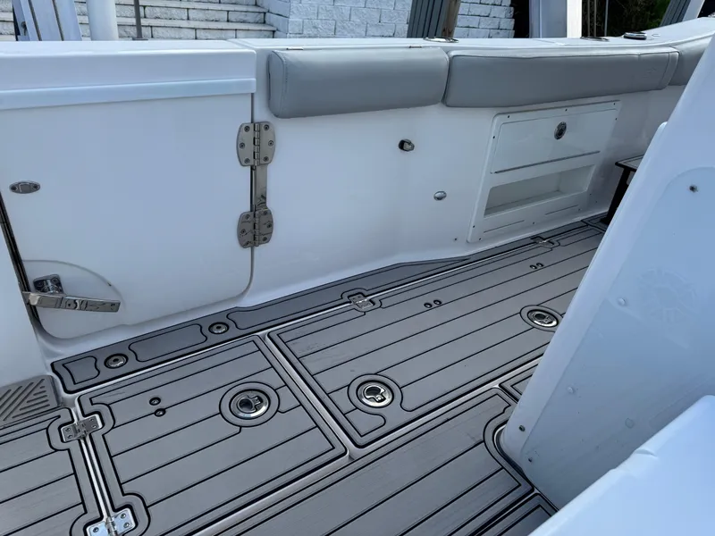 Slide: The Image of 2023 Sea Fox 328 Commander boat interior with sleek, modern flooring and seating. - 26