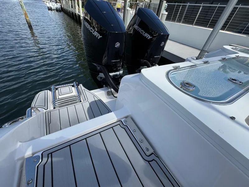 Slide: The Image of 2023 Sea Fox 328 Commander boat with twin Mercury engines docked at marina. - 32