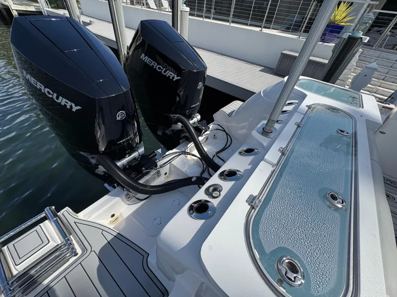 Slide: The Image of 2023 Sea Fox 328 Commander with dual Mercury outboard engines at a dock. - 33
