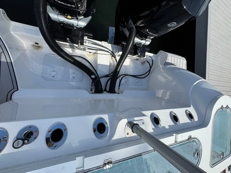 Slide: The Image of 2023 Sea Fox 328 Commander boat deck with engine and rod holders. - 34