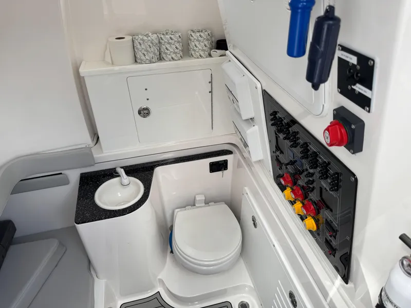 Slide: The Image of 2023 Sea Fox 328 Commander boat interior with toilet and control panel. - 36