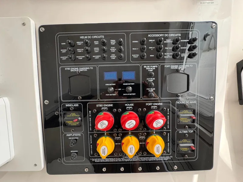 Slide: The Image of Electrical control panel on 2023 Sea Fox 328 Commander boat, featuring various circuit switches and dials. - 38