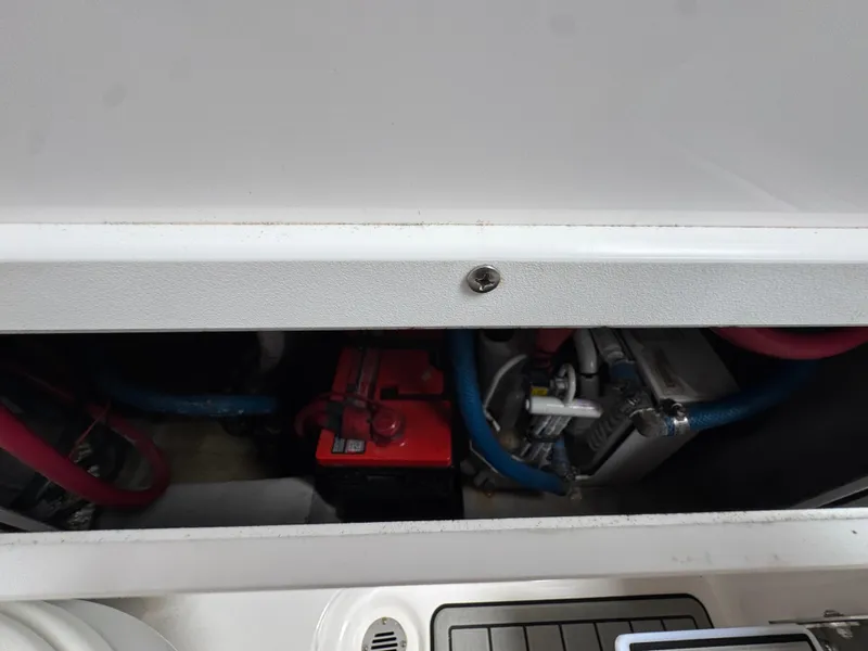 Slide: The Image of 2023 Sea Fox 328 Commander boat battery compartment with visible wiring and components. - 40