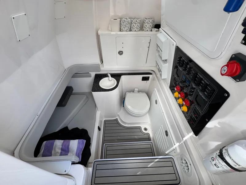 Slide: The Image of 2023 Sea Fox 328 Commander boat interior with toilet and control panel. - 44
