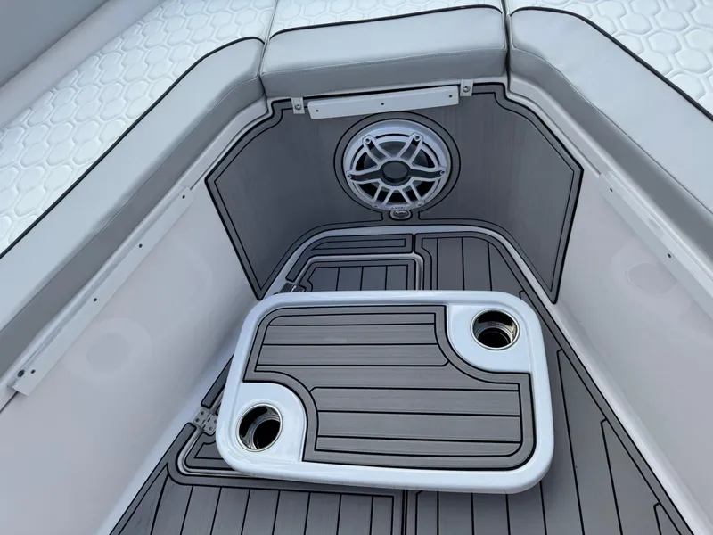Slide: The Image of 2023 Sea Fox 328 Commander boat interior with cushioned seating and cup holders. - 49