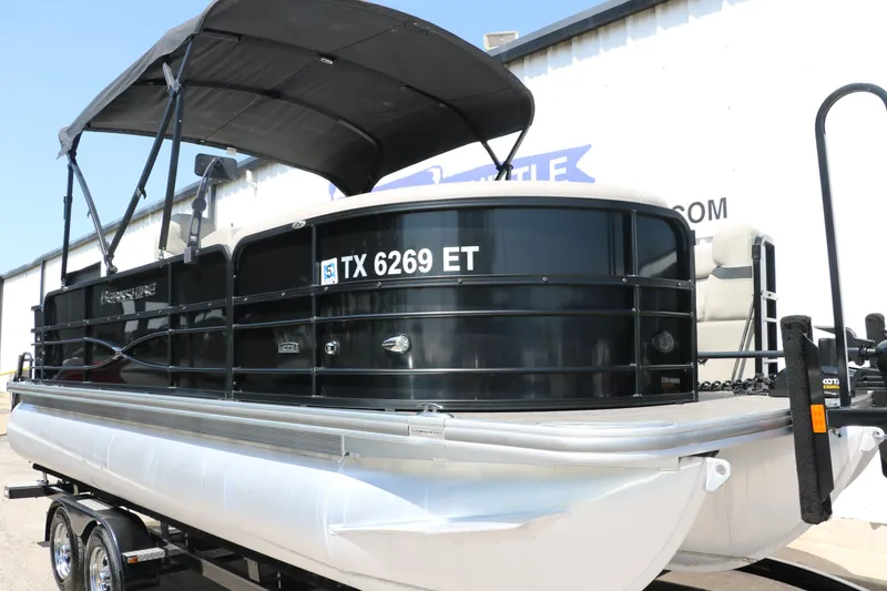 Slide: The Image of 2019 Berkshire 211RFC CTS pontoon boat with black canopy on trailer. - 11