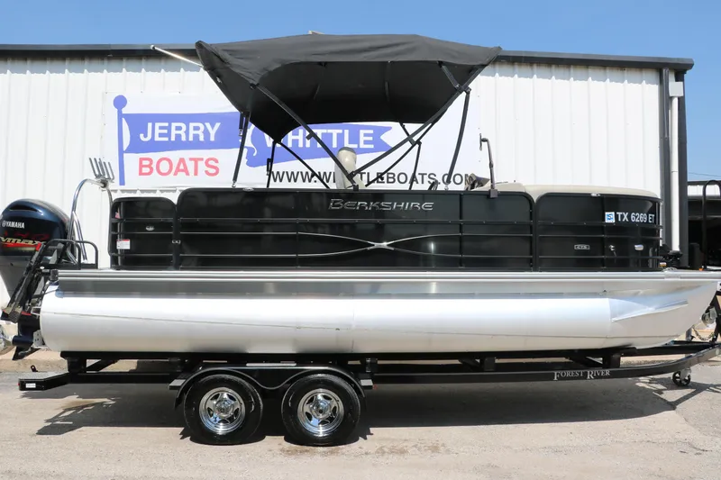 Slide: The Image of 2019 Berkshire 211RFC CTS pontoon boat on trailer, displayed at Jerry Whittle Boats dealership. - 14