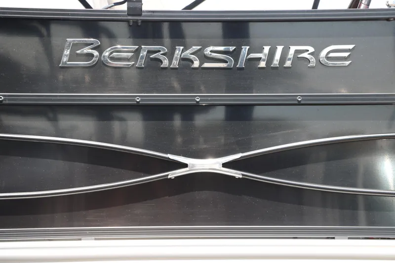 Slide: The Image of 2019 Berkshire 211RFC CTS boat logo on a sleek black surface. - 15
