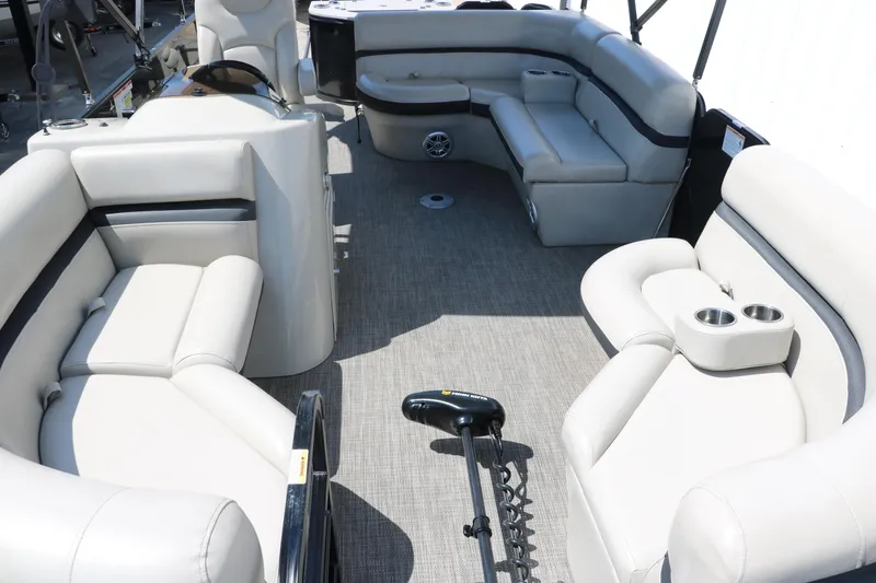 Slide: The Image of 2019 Berkshire 211RFC CTS pontoon boat interior with plush seating and cup holders. - 17