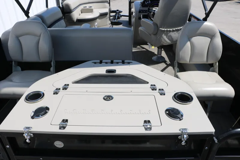 Slide: The Image of 2019 Berkshire 211RFC CTS boat interior with seating and control panel. - 18
