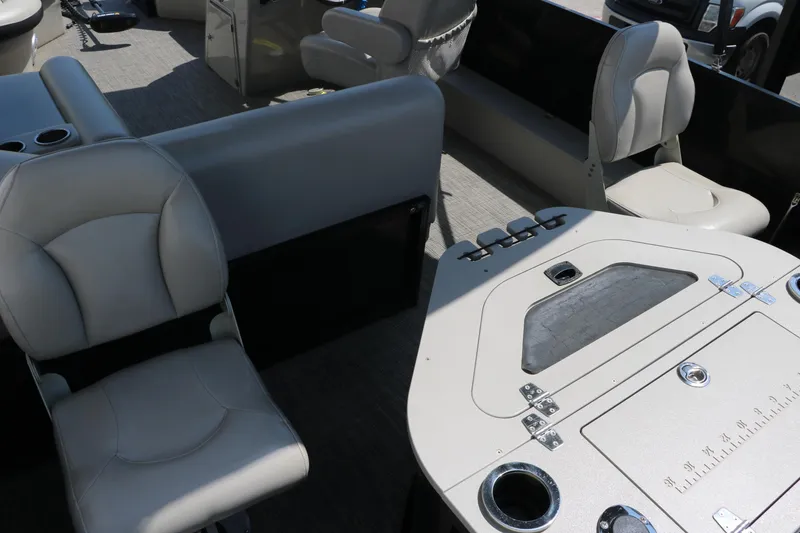 Slide: The Image of 2019 Berkshire 211RFC CTS boat interior with seating and table setup. - 21