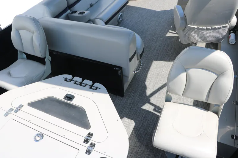 Slide: The Image of 2019 Berkshire 211RFC CTS boat interior with gray seating and table. - 23