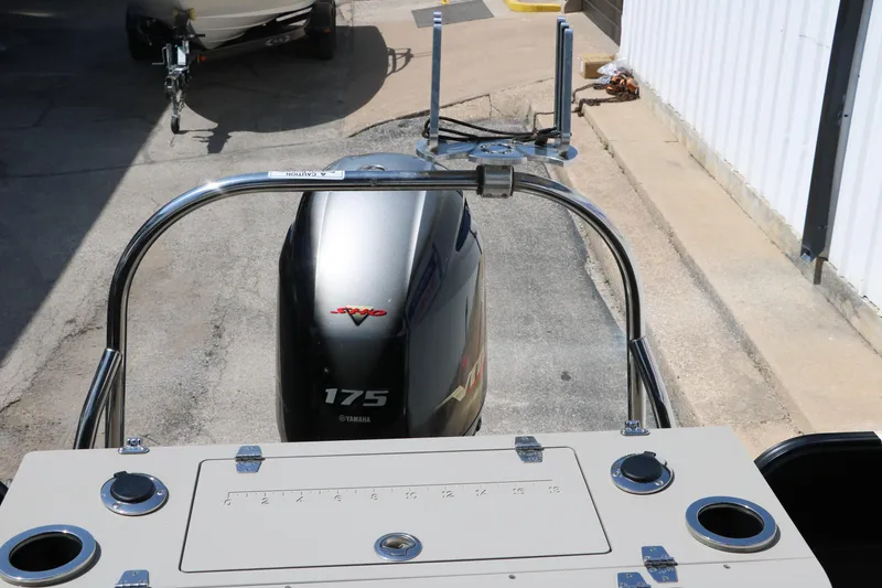 Slide: The Image of 2019 Berkshire 211RFC CTS boat with Yamaha 175 engine, docked outdoors. - 25