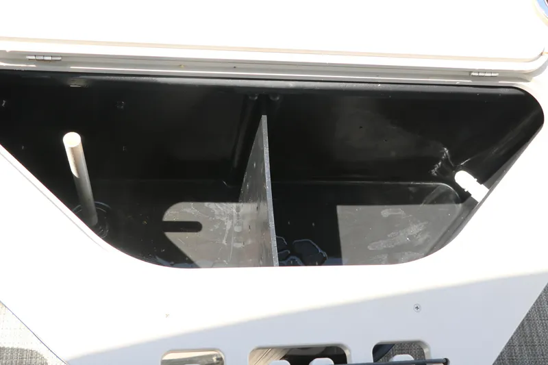 Slide: The Image of Open storage compartment in a 2019 Berkshire 211RFC CTS boat. - 26