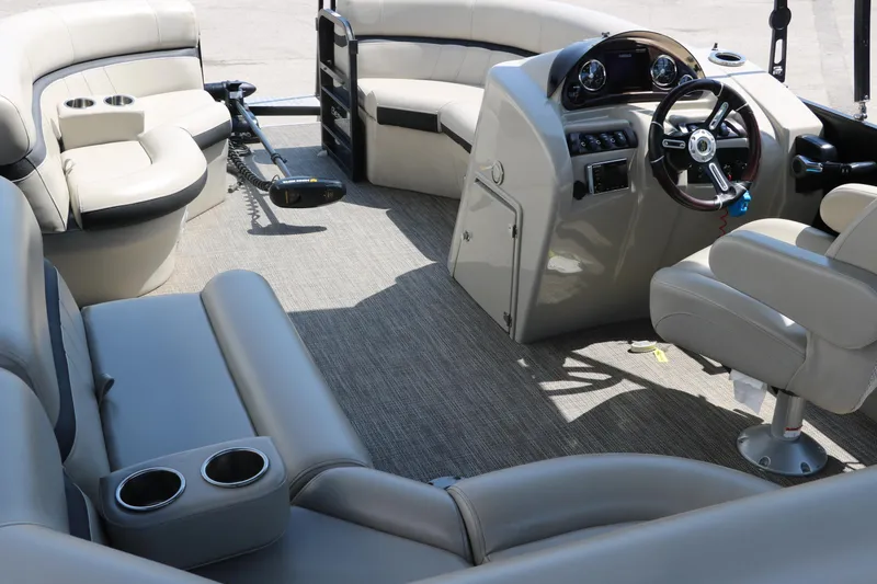 Slide: The Image of 2019 Berkshire 211RFC CTS pontoon boat interior with plush seating and modern helm. - 28