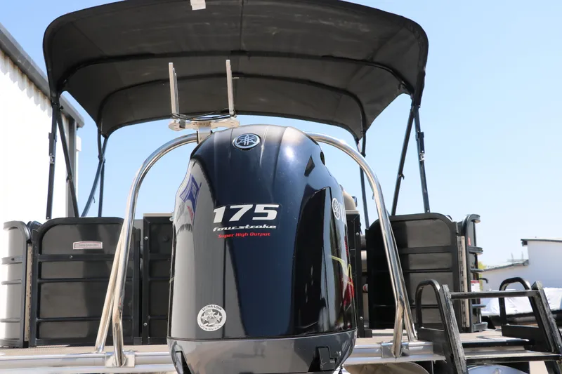 Slide: The Image of 2019 Berkshire 211RFC CTS boat with 175 horsepower engine, black canopy, and sleek design. - 5