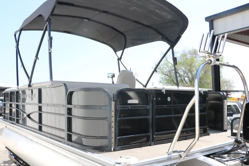 Slide: The Image of 2019 Berkshire 211RFC CTS pontoon boat with canopy, docked outdoors. - 7