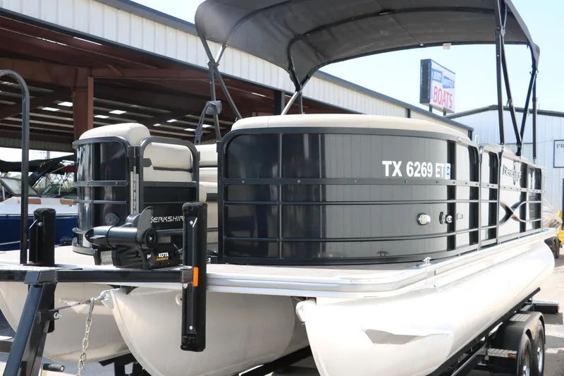 Slide: The Image of 2019 Berkshire 211RFC CTS pontoon boat with canopy, docked at a marina. - 8