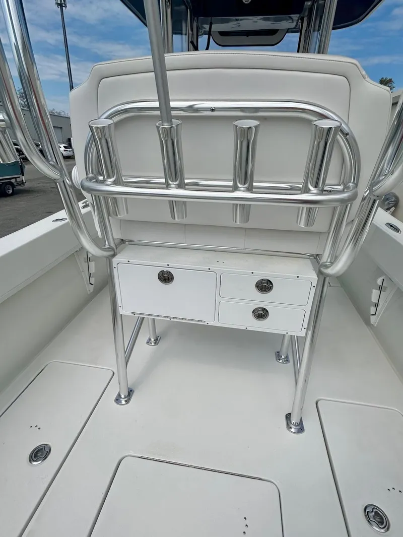 Slide: The Image of 2025 Pair Customs 28 Center Console boat interior with rod holders and storage drawers. - 6