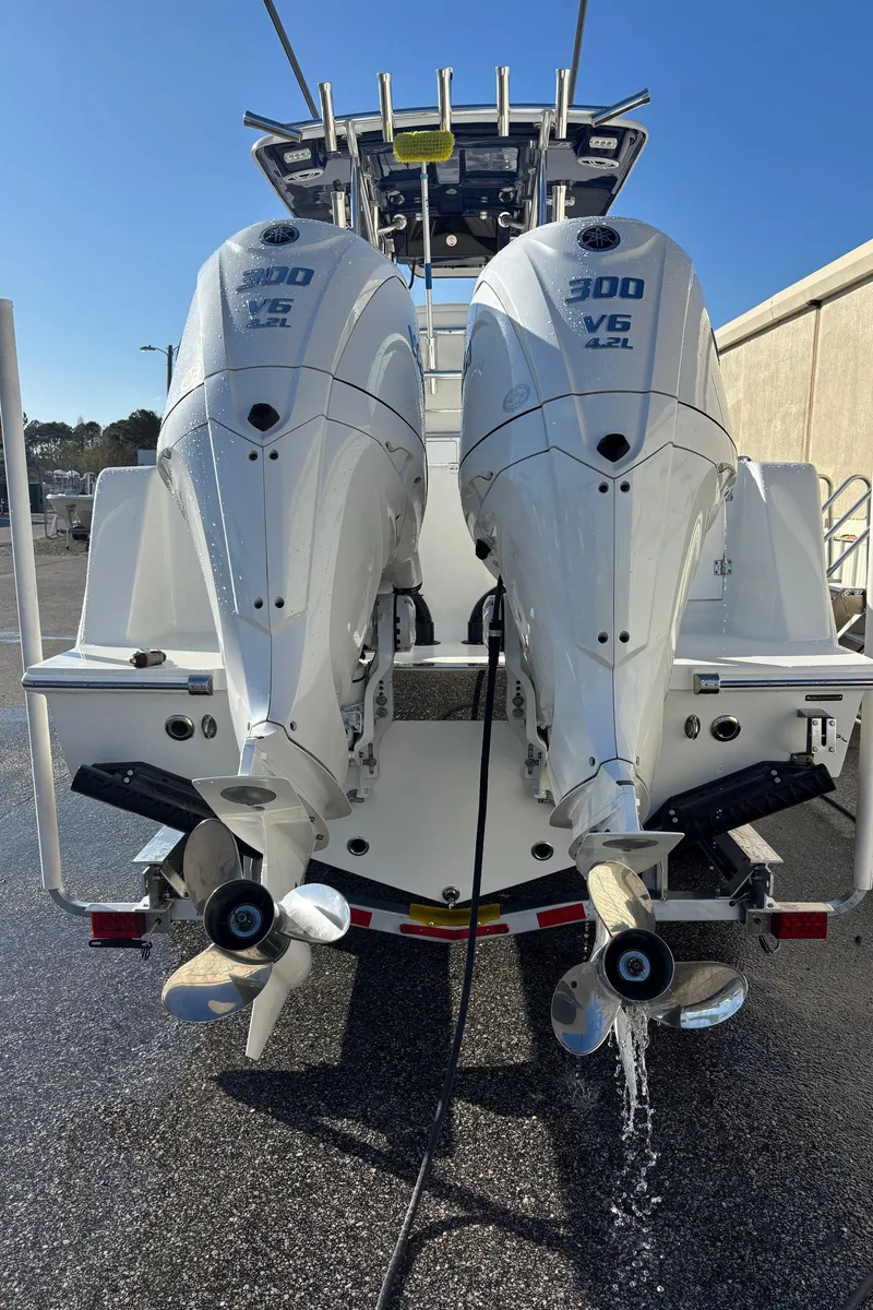 Slide: The Image of 2025 Pair Customs 28 Center Console with twin 300 V6 engines, rear view. - 8