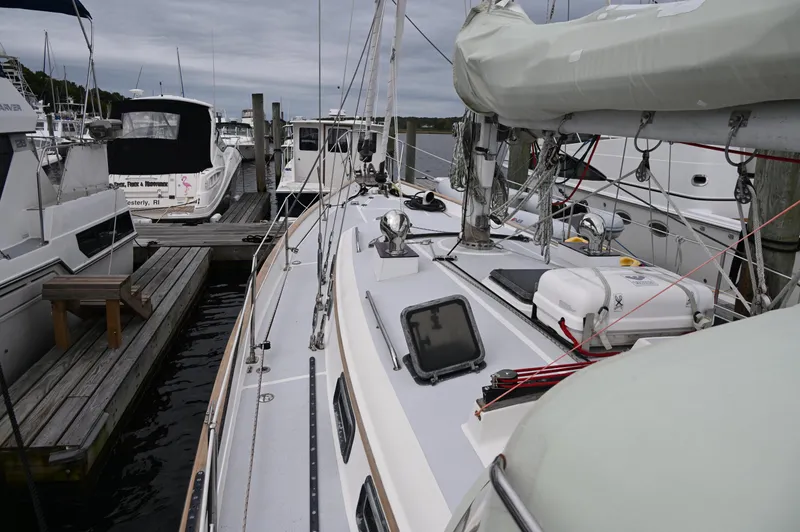 Slide: The Image of 1984 Southern Cross 39 sailboat docked at marina, overcast sky, surrounded by other boats. - 12