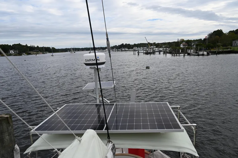 Slide: The Image of Sailboat with solar panels on a calm river, Southern Cross 39, 1984 model. - 14
