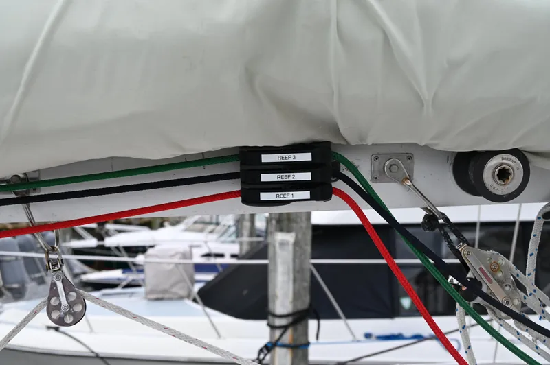 Slide: The Image of Sailing rigging on a 1984 Southern Cross 39 yacht, featuring labeled reefing lines. - 17