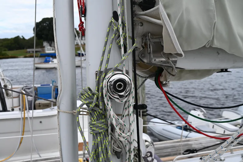 Slide: The Image of Close-up of rigging on a 1984 Southern Cross 39 sailboat docked by the water. - 19