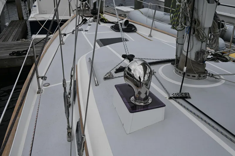 Slide: The Image of 1984 Southern Cross 39 sailboat deck with rigging and polished fittings. - 21