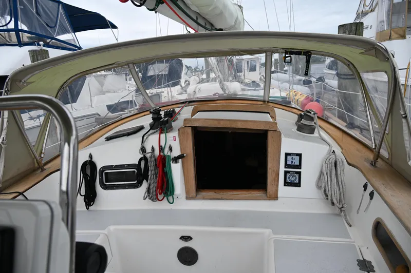 Slide: The Image of Cockpit of a 1984 Southern Cross 39 sailboat with ropes and navigation equipment. - 24