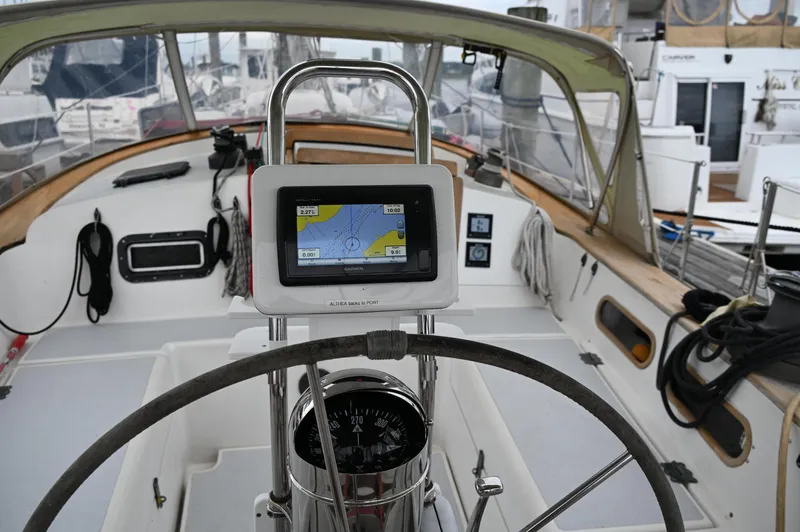 Slide: The Image of Cockpit of 1984 Southern Cross 39 sailboat with navigation equipment and steering wheel. - 25