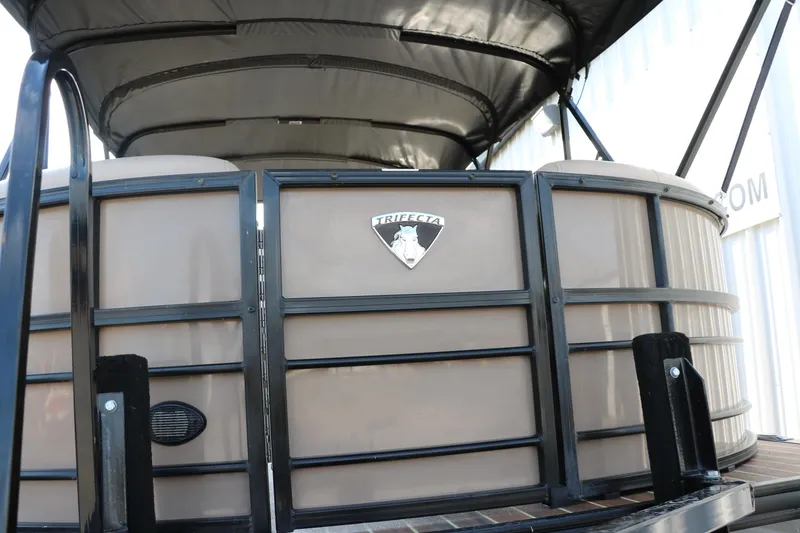 Slide: The Image of 2018 Trifecta 23 RFE pontoon boat with canopy and logo. - 16
