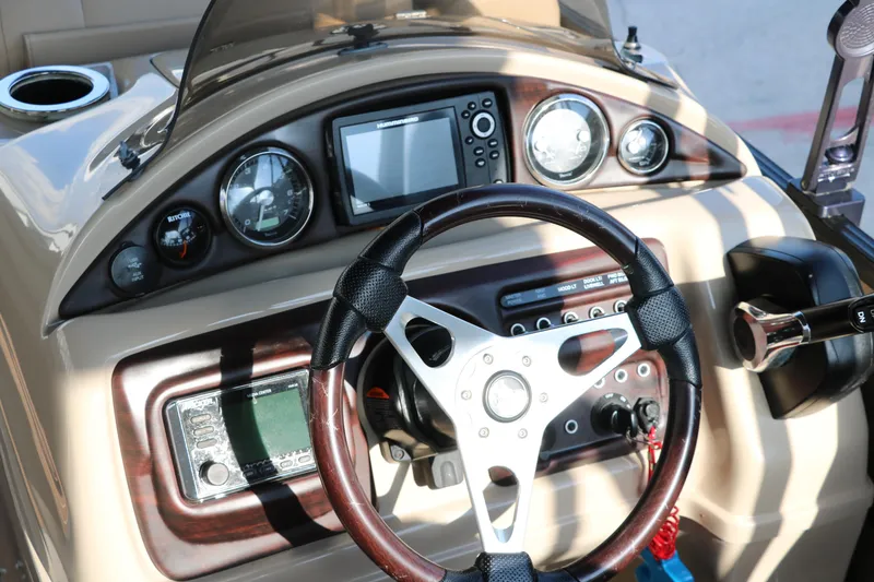 Slide: The Image of Steering console of 2018 Trifecta 23 RFE boat with gauges and controls. - 28