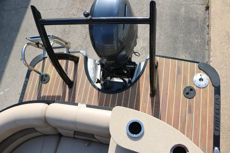 Slide: The Image of 2018 Trifecta 23 RFE boat with outboard motor and wood deck. - 36