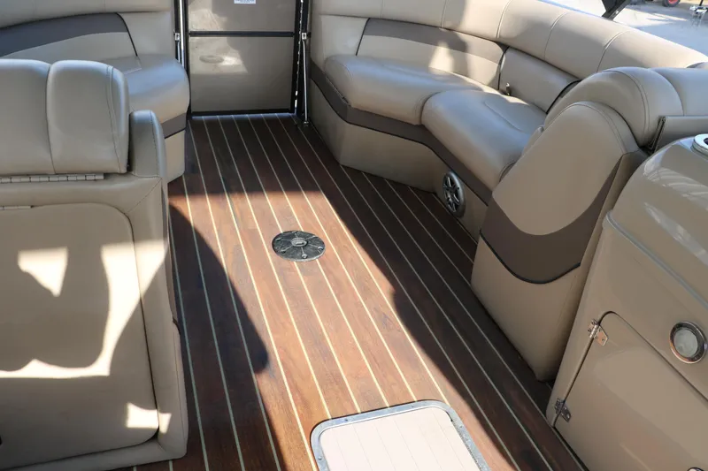 Slide: The Image of Luxurious interior of 2018 Trifecta 23 RFE boat with plush seating and wood flooring. - 40