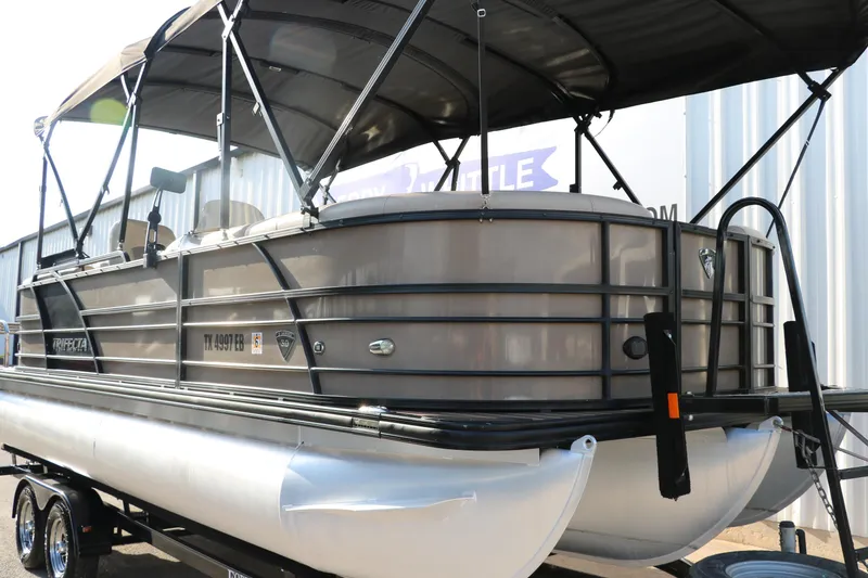 Slide: The Image of 2018 Trifecta 23 RFE pontoon boat with canopy on trailer. - 42