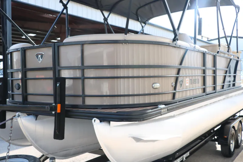 Slide: The Image of 2018 Trifecta 23 RFE pontoon boat on trailer, featuring sleek design and canopy. - 7