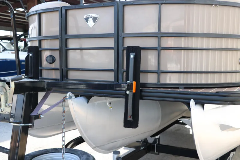 Slide: The Image of 2018 Trifecta 23 RFE pontoon boat on trailer, close-up view. - 8